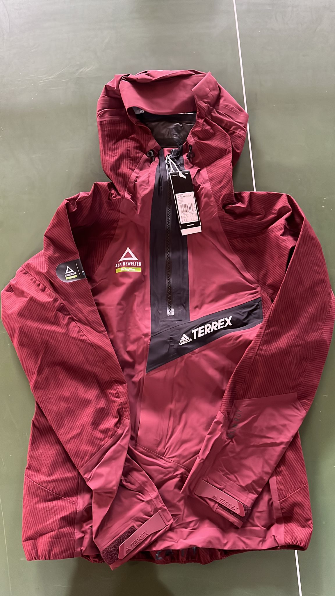 W TRK PRIMEKNIT Regenhoodie